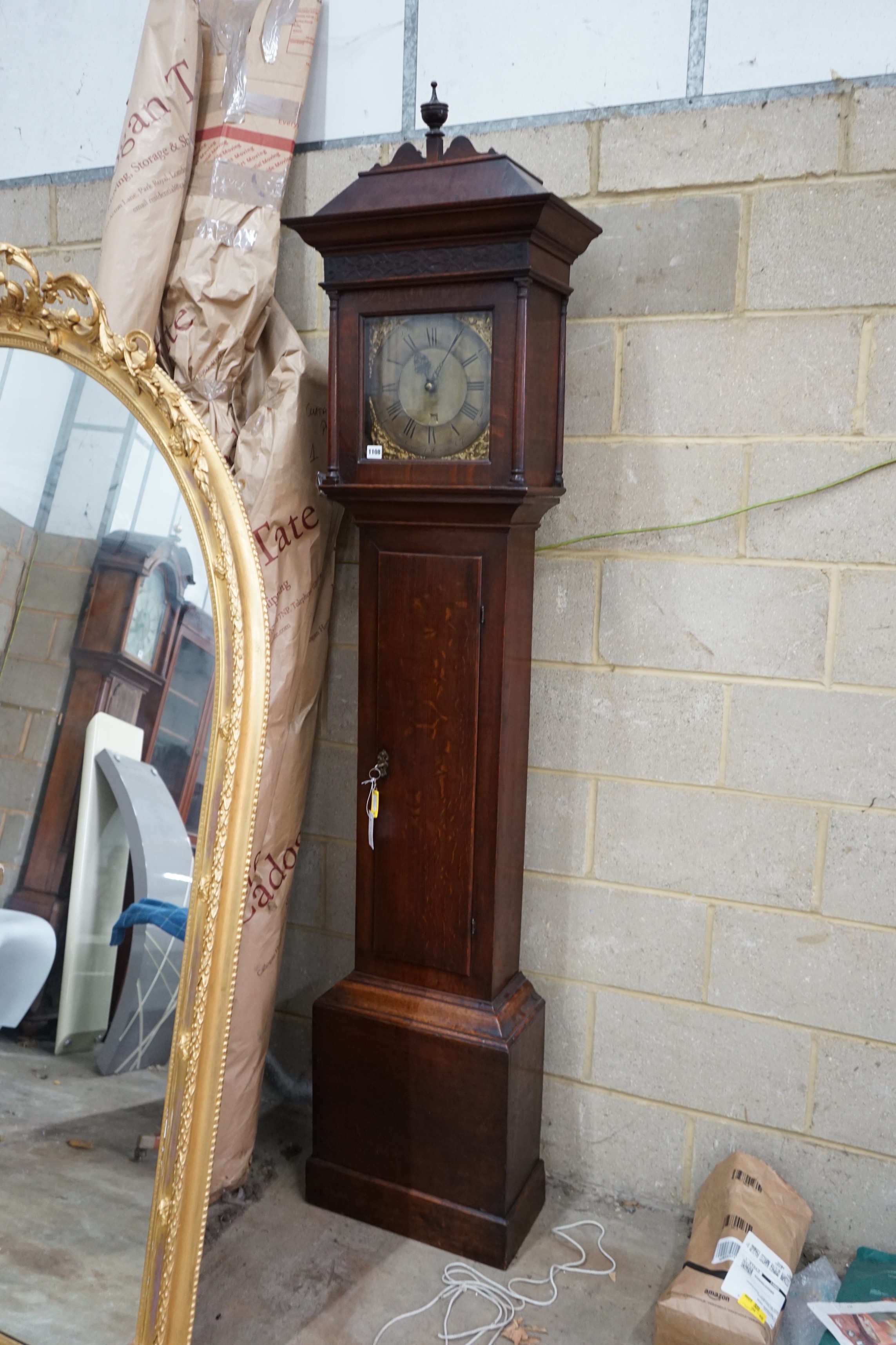 A George III oak 30 hour longcase clock, brass dial marked Amos Kelsall, Hereford, height 220cms.